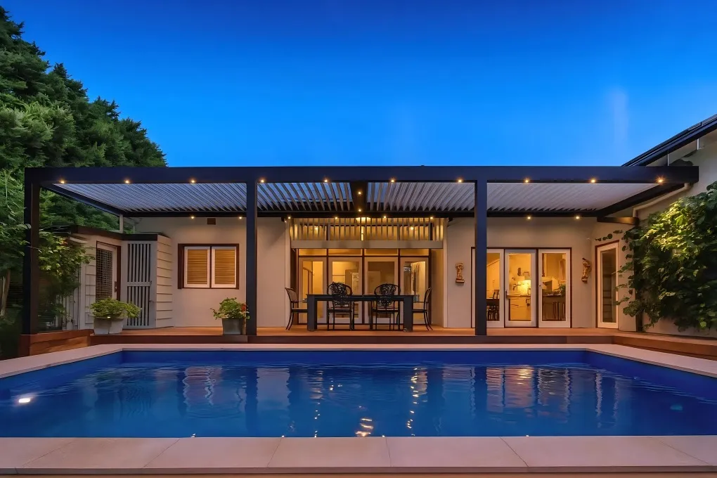 Modern pergola with recessed spotlights integrated into the beams, providing precise downward illumination for a dining area.