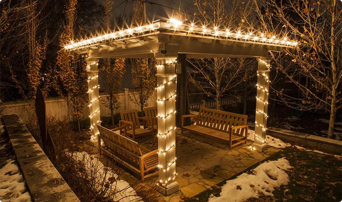 Vertical pillar wrapping with LED fairy lights to highlight pergola height and architectural posts